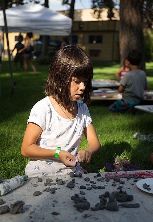 &lt;p&gt;TESS FREEMAN/Press&lt;/p&gt;&lt;p&gt;Mika Nasta, 6, molds a squirrel out of clay at the kids craft area, part of the Art on the Green event at the NIC campus.&lt;/p&gt;