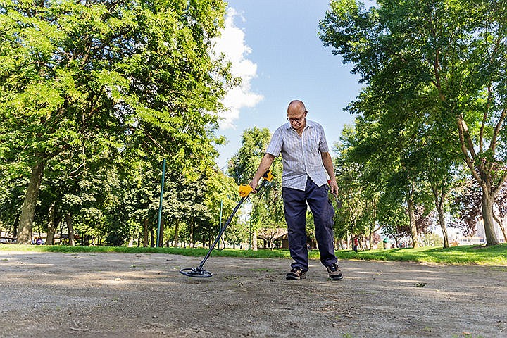 &lt;p&gt;SHAWN GUST/Press&lt;/p&gt;&lt;p&gt;Bill Smith uses a metal detector in a sandy volleyball court Tuesday at the Coeur d&#146;Alene City Park. Smith, who has been metal detecting for about 35 years, pulled his largest haul of 70 holed coins in South Korea, including a Chinese coin dating back 1,000 years.&lt;/p&gt;
