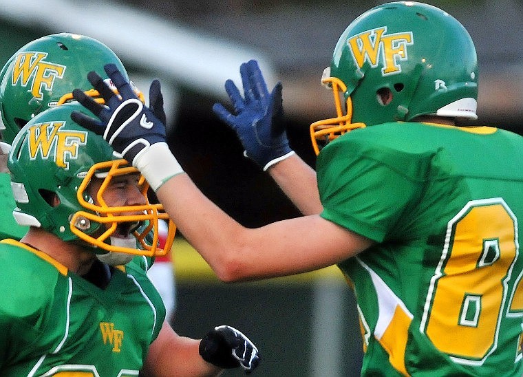 Whitefish Running Back Jeremy Nielsen (left) celebrates his touchdown with Connor Ellis.