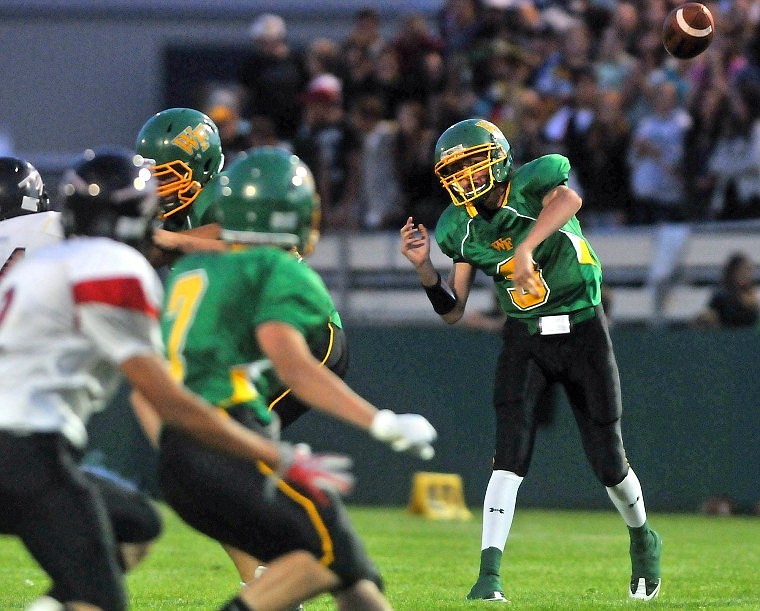 Whitefish Quarterback Connor Donahue throws to wide reciever Christopher Forrest (7) in the second half.