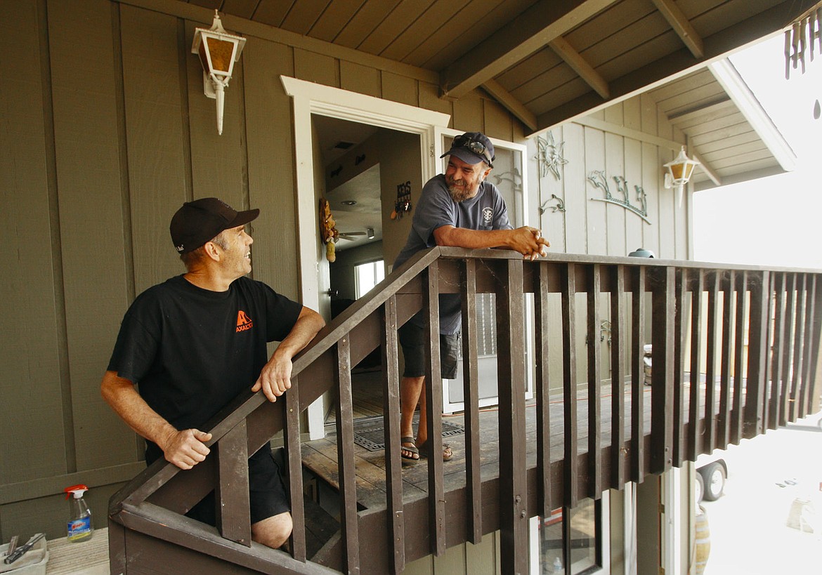 &lt;p&gt;Oak Shores residents Jimmy Lauderdale, left, and Johnnie Smith talk about why they haven't evacuated their homes at Oak Shores during a wildfire in Paso Robles, Calif., Tuesday, Aug. 23, 2016. A wildfire on California's central coast grew to nearly 58 square miles Tuesday. Several thousand people remained under evacuation orders in San Luis Obispo and Monterey counties, where the stubborn blaze had destroyed at least 36 residences. (Joe Johnston/The Tribune (of San Luis Obispo) via AP)&lt;/p&gt;