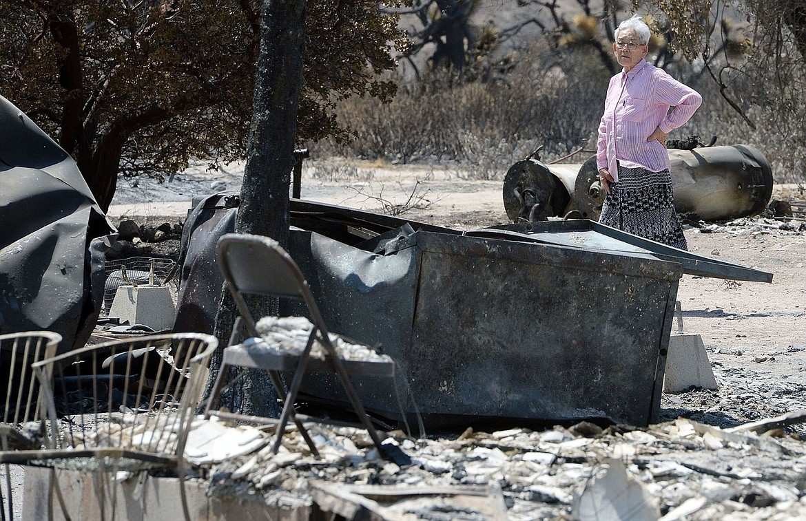 &lt;p&gt;Ki Jo So returns to her home and property burned by a wildfire off Highway 138, near Wrightwood, Calif., for the first time Monday, Aug. 22, 2016. So, who has lived on the property for 13 years with her family, had no insurance. Sixty miles east of Los Angeles, minimal activity was seen at fire that burned nearly 58 square miles and 105 homes in Cajon Pass and the San Gabriel Mountains last week. (Will Lester/The Inland Valley Daily Bulletin via AP)&lt;/p&gt;