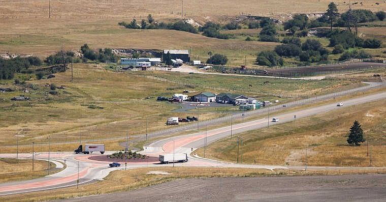 &lt;p&gt;Trucks drive through a roundabout on the U.S. 93 Alternate Route on Thursday afternoon.&lt;/p&gt;