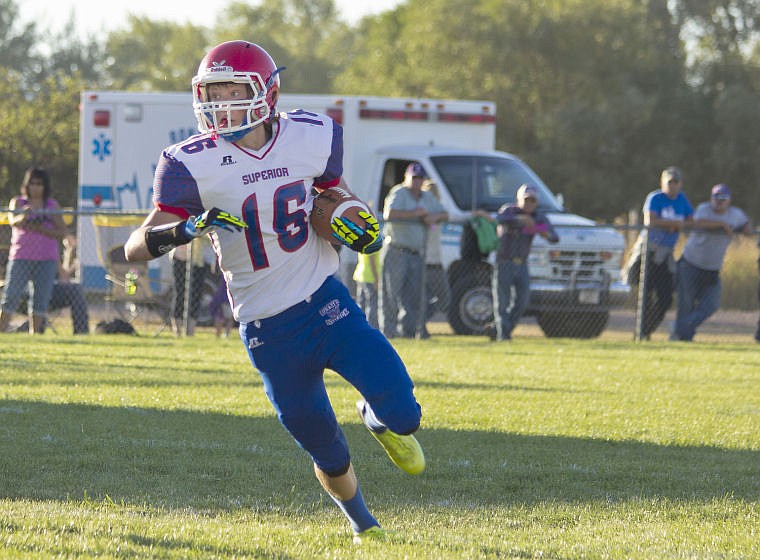 <p>Superior Bobcat running back Tucker Smith carries the ball against Charlo during the season opener on Saturday.</p>