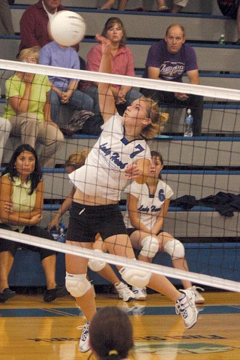 Jennifer McBride/Valley Press Thompson Falls junior Kyla Molzhon spikes the ball at the Lady Wardens Saturday in the Lady Hawks&#146; home opener. The Lady Hawks went 3-1, going 25-17 in their final game.