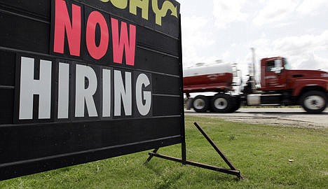 &lt;p&gt;An oil truck passes a &quot;now hiring&quot; sign in Kennedy, Texas, May 9, 2012.&lt;/p&gt;