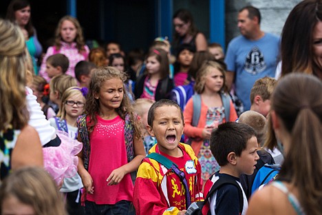 &lt;p&gt;As the first day of school gets out at Prairie View Elementary, Michael Chavez, 9, yells as he walks through a crowd of students Tuesday. The Post Falls school is now accommodating over 650 students says Jenelle Baker, the principal of Prairie View.&lt;/p&gt;
