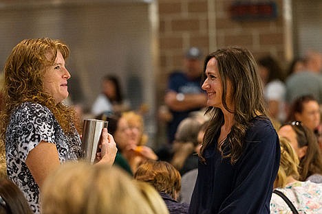 &lt;p&gt;Genca Moon, a kindergarten teacher at Borah Elementary School, left, and Virginia Shawver, a district employee in the CDA4Kids program, visit after having breakfast at the Back to School Breakfast event Thursday.&lt;/p&gt;