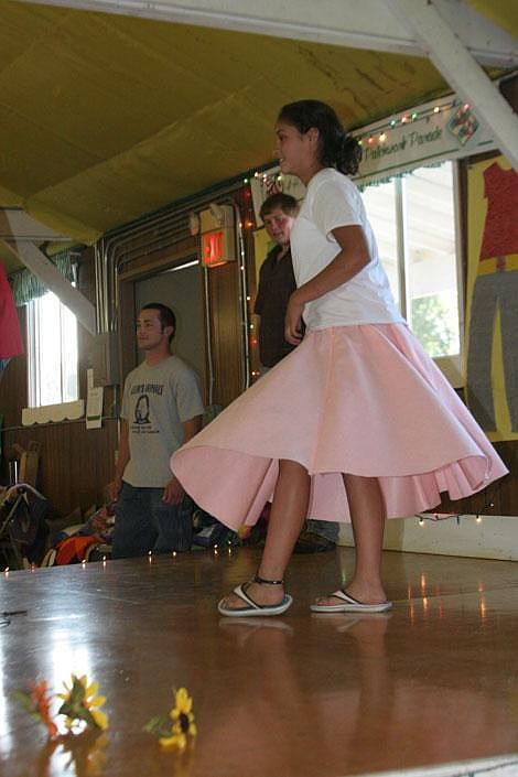 Jamie Doran/Valley Press Amanda Woods, 13, spins in a circle to show off the poodle skirt she made. Woods also made pajama pants that she displayed.