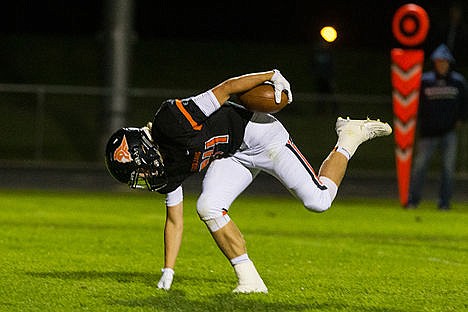 &lt;p&gt;Post Falls&#146; Zach Hillman posts a hand on the ground while trying to find his balance after breaking a tackle on his way to the end zone for a fourth quarter touchdown vs. Skyview.&lt;/p&gt;