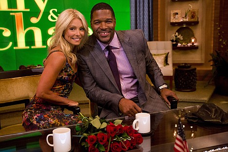 &lt;p&gt;Former football player Michael Strahan, right, poses Kelly Ripa on the set of the newly named &quot;Live! with Kelly and Michael&quot; on Tuesday, Sept. 4, 2012 in New York. Strahan joined the popular morning show as a permanent co-host on Tuesday, fulfilling a joking prophecy he made to Regis Philbin more than four years ago. The gap-toothed former New York Giant jogged onto the morning show set and picked up co-host Kelly Ripa in a bear hug, lifting her off her feet. He replaces Philbin, who left last November. Strahan was the survivor in a series of on-air tryouts of potential co-hosts since Philbin left, and his hiring has been an open secret for the past two weeks. (Photo by Charles Sykes/Invision/AP Images)&lt;/p&gt;