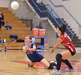 Spikers get conference win, beat Loggers