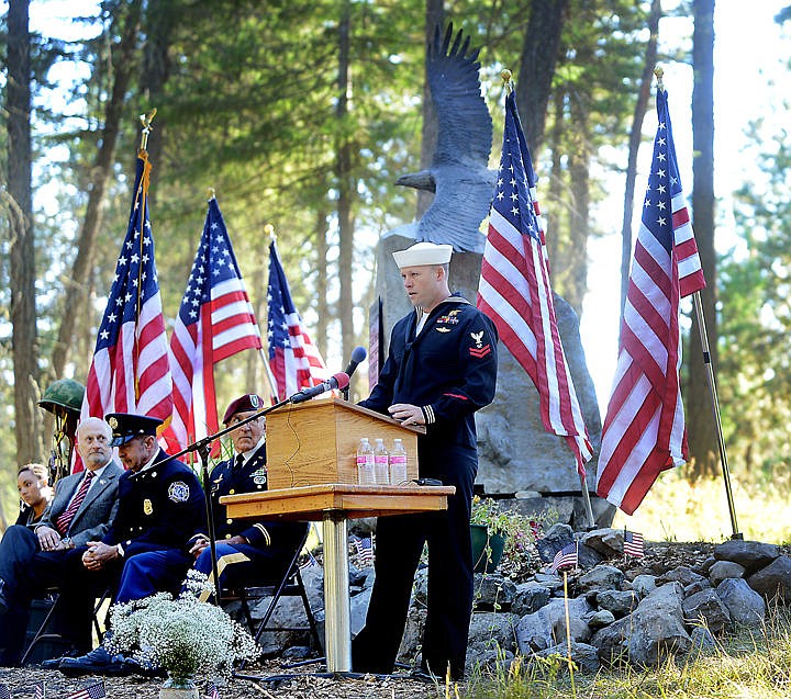 &lt;p&gt;Jeremy Mahugh, a former Navy SEAL, reads a letter from Cheryl Croft Bennett, the mother of slain Navy SEAL Tyrone Woods at the opening ceremony of the To Honor the Four memorial in Bigfork on September 11, 2014.&#160; (Brenda Ahearn/Daily Inter Lake)&lt;/p&gt;