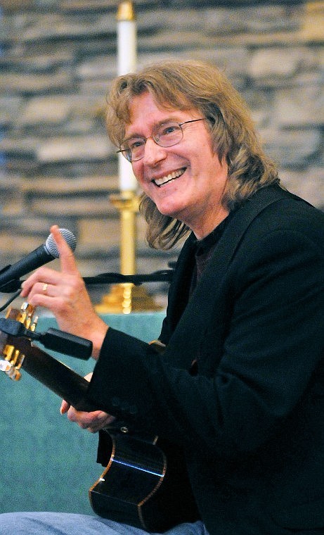 Grammy-award winner Doug Smith talks with the audience between performances Thursday night at Bethany Lutheran Church.