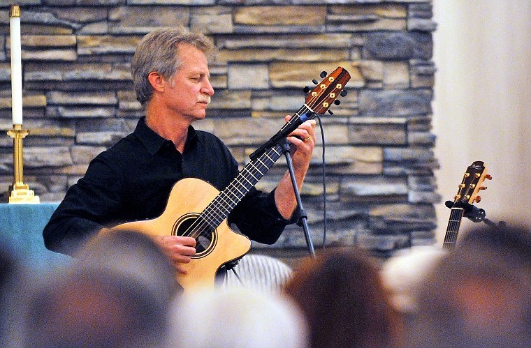 Fingerstyle guitarist Alex De Grassi plays a tune in front of a crowd gathered at Bethany Lutheran Church on Thursday night.