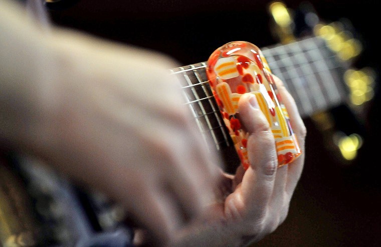 Helping to create the unique sound on the slide guitar is a &#147;bottleneck,&#148; which is often made from glass bottles.