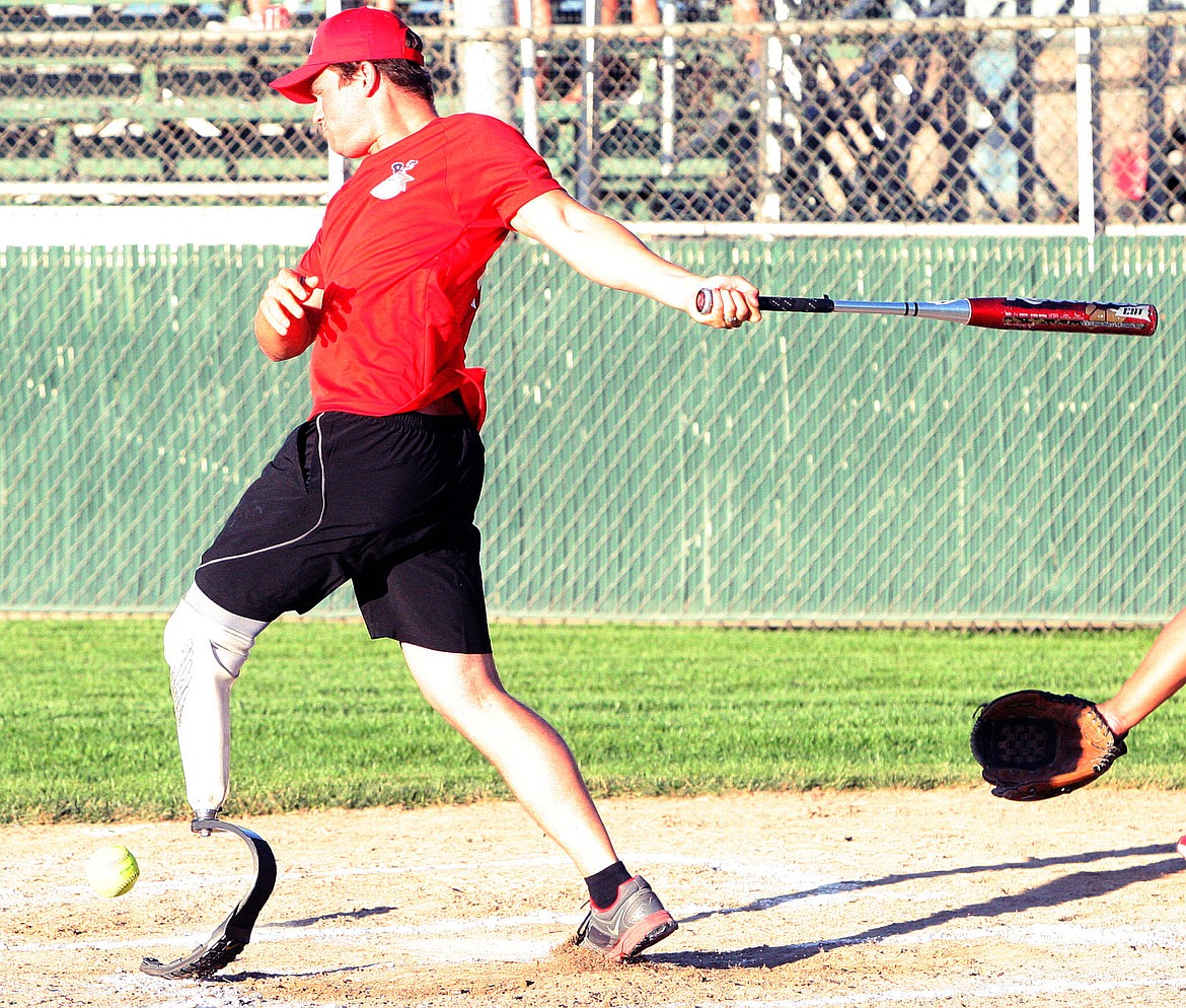 Moses Lake firefighter Simon Rillera takes his swings during the annual Battle of the Badge softball game with the police department.