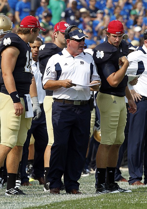 &lt;p&gt;Notre Dame head coach Brian Kelly calls a play against South Florida during the first half of Saturday's game in South Bend, Ind. USF won 23-20.&lt;/p&gt;