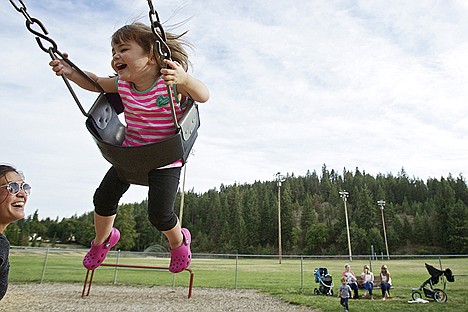 &lt;p&gt;Brooke Carey watches her daughter Paige Carey, 1, swing at the McEuen Field playground Wednesday in downtown Coeur d'Alene. A groundbreaking ceremony will take place Monday for the McEuen Field project.&lt;/p&gt;