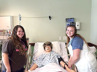 &lt;p&gt;Alexyss Camen (Left) and Hunter Butler (right) working on a mannequin.&lt;/p&gt;