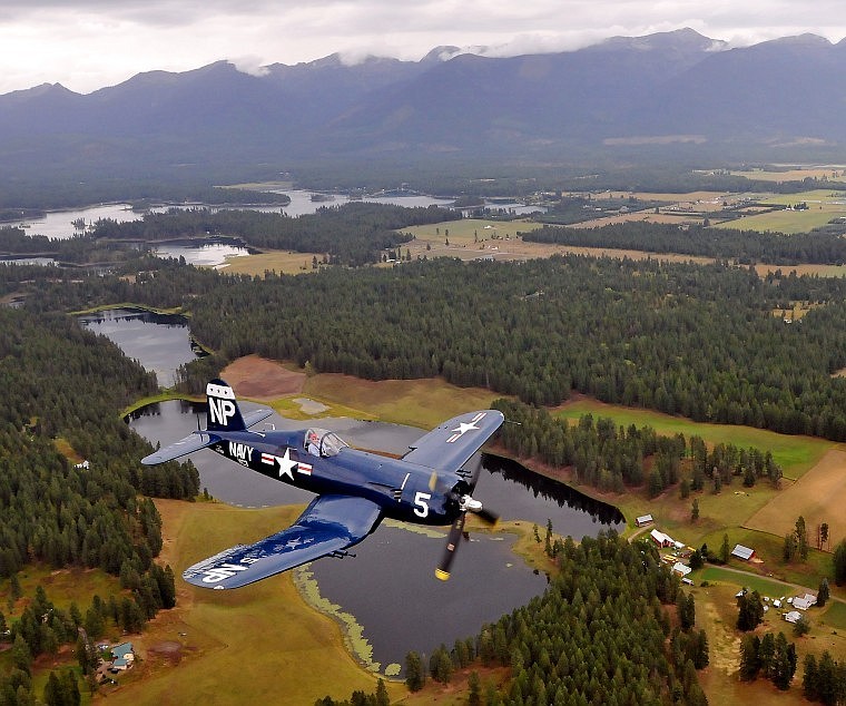 A Corsair plane piloted by Steve Bakke flies past Echo Lake.