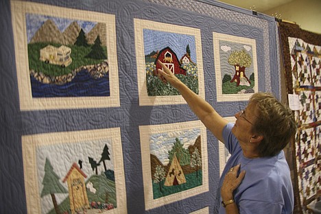 &lt;p&gt;Wanda Wemhoff, co-chair of the quilting show at the Paul Bunyan Days events, points out the detail on the people's choice award winning quilt. It was made by Lois Noble and is owned by Aleida Quick of St. Maries.&lt;/p&gt;