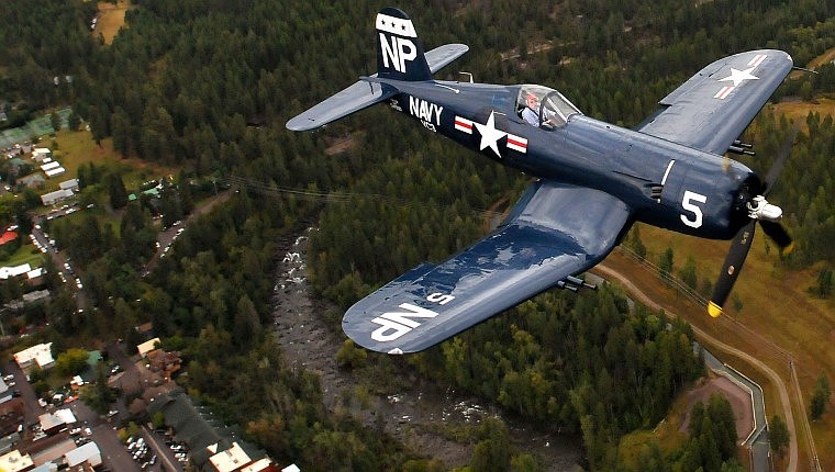 A Corsair plane piloted by Steve Bakke flies over Bigfork.