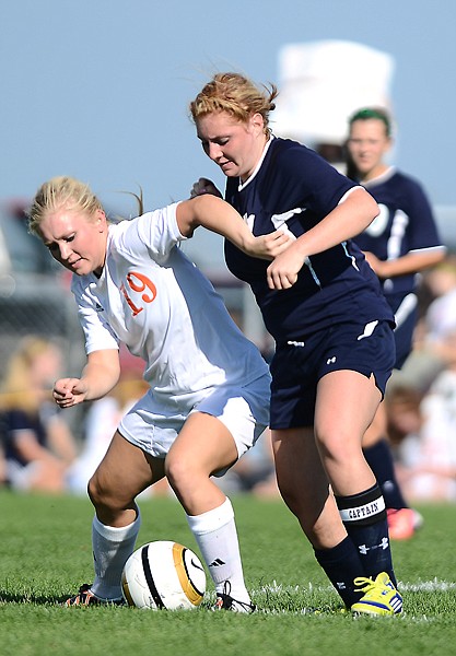 &lt;p&gt;Flathead senior Paige Birky (19) fights with Glacier senior Mikey Staats (11) for possession of the ball during their game on Thursday evening in Kalispell. The Glacier girls won the match up 1-0.(Brenda Ahearn/Daily Inter Lake)&lt;/p&gt;