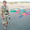 Scout paints playground maps