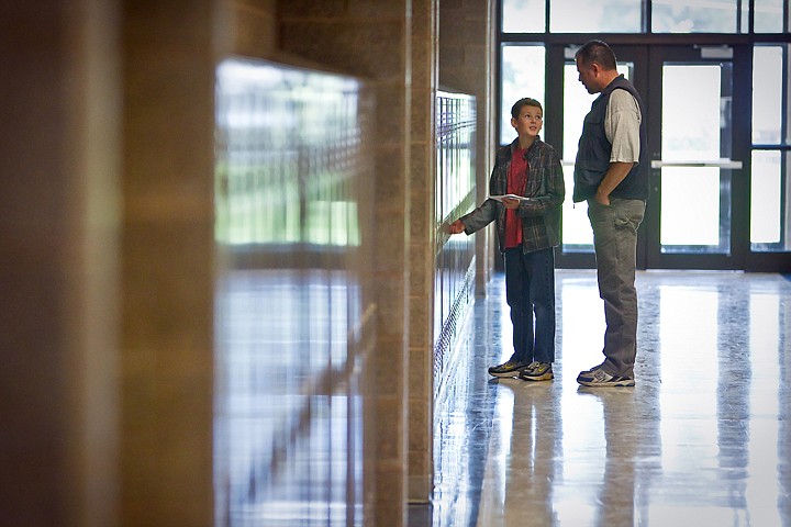 &lt;p&gt;JEROME A. POLLOS/Press Zach Dugger, 13, looks back toward his father Eric Dugger as he tries to figure out the combination to his locker Wednesday at River City Middle School in Post Falls. Students received their class schedules, locker assignments and tour the school so they could be familiar with the classrooms on the first day of school Tuesday.&lt;/p&gt;