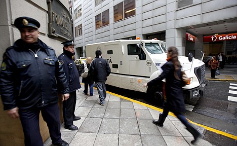 &lt;p&gt;In this photo taken Sept. 2, 2010, police officers guard outside a bank in downtown Buenos Aires, Argentina. Argentines reluctance to use the banking system makes them attractive targets for attackers because they prefer to carry cash, even for large operations, such as buying cars or properties.&lt;/p&gt;