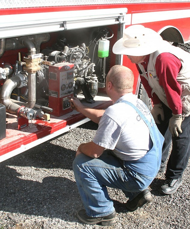 &lt;p&gt;West End Assistant Fire Chief Art Drobny and Fire Chief Bruce
Charles adjust water valves before using a water hose.&#160;&lt;/p&gt;