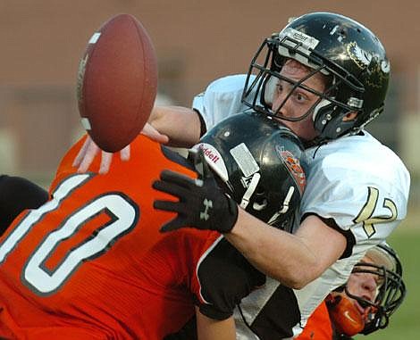 Seeley-Swan junior tight end Cody Kuhlews can&#146;t hang on to a pass as Eureka&#146;s Brady Meekhof slams into him during Thursday night&#146;s game in Eureka. Kuhlews had three touchdown receptions in Seeley-Swan&#146;s 20-6 win. Jennifer DeMonte/Daily Inter Lake