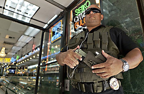 &lt;p&gt;ADVANCE FOR TUESDAY SEPT. 6 - In this photo taken Thursday, Aug. 25, 2011, private security guard Gus Rodriguez stands outside &quot;El Palacio de Oro&quot; jewelry store in downtown Los Angeles. It?s just one aspect of the gold fever now sweeping the country?s criminal world. Law enforcement officials across the nation and beyond say they are seeing an uptick in robberies that correlates with gold?s record-high prices. (AP Photo/Damian Dovarganes)&lt;/p&gt;