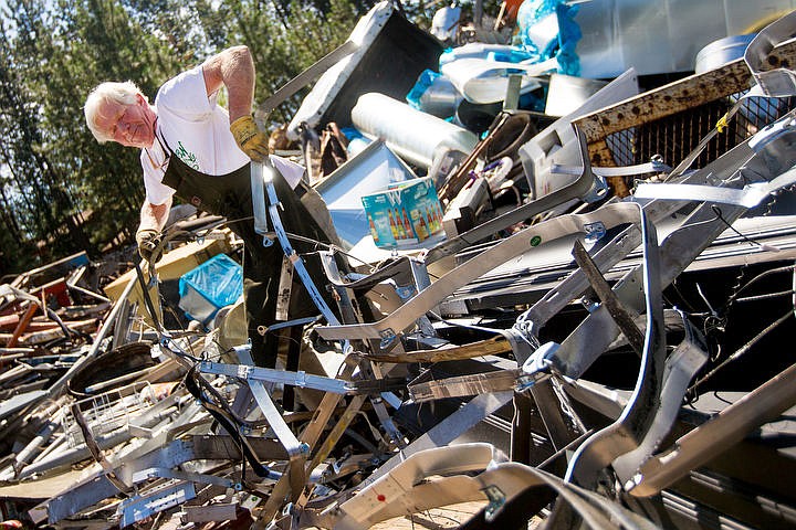 &lt;p&gt;Eric York drags scraps of steel from a trailer into a dump pile on Wednesday at Hern Iron Works in Coeur d'Alene. York has frequently recycled scrap metal at Hern Iron Works for five years.&lt;/p&gt;