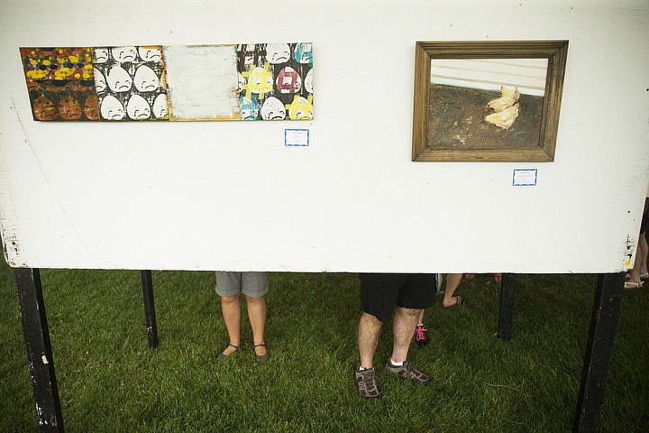 &lt;p&gt;People view art at the Juried Art Show at Art on the Green.&lt;/p&gt;