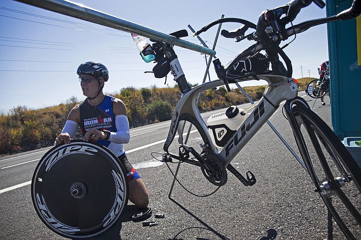 &lt;p&gt;Walt Schrading of Birmingham, Ala., fixes his flat tire at an aid station on Highway 95.&lt;/p&gt;