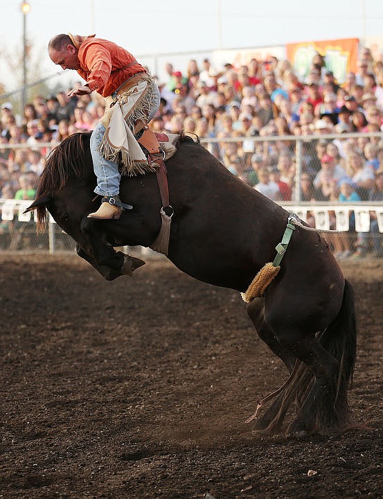 &lt;p&gt;Jed McKinlay holds on as he is bucked up and down while riding bareback Friday night at the Gem State Stampede Coeur d'Alene PRCA Rodeo.&lt;/p&gt;