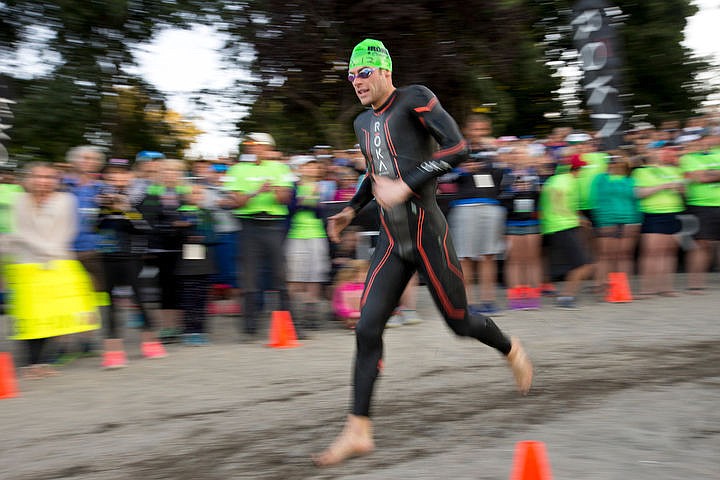 &lt;p&gt;Tim Cotreau of Manchester, New Hampshire navigates the turn-around corner of the 2.4 mile swim portion.&lt;/p&gt;