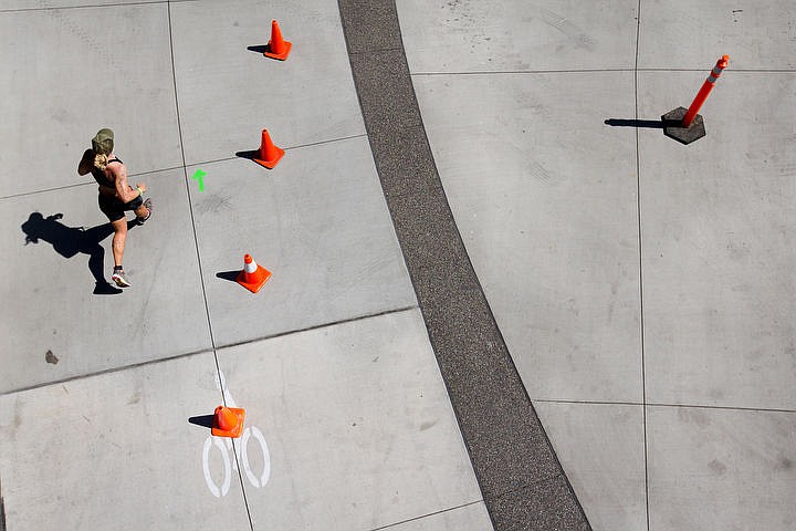 &lt;p&gt;An Ironman athlete runs underneath the Coeur d'Alene Resort skybridge on her second loop of the 26.2 mile running portion.&lt;/p&gt;