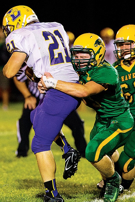 &lt;p&gt;Lakeland's Colton Butcher takes down Lewsiton High School running back Jake Ralston in the second half.&lt;/p&gt;