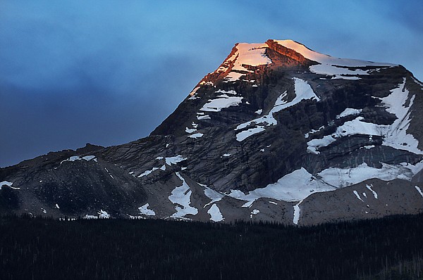 &lt;p&gt;The 8,987-foot summit of Heavens Peak catches the first rays of
sunrise in Glacier National Park.&lt;/p&gt;