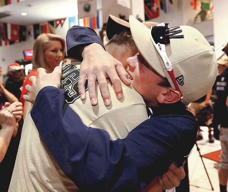 &lt;p&gt;Gabe Sulser hugs his brother Ben as Big Sky Little League
players arrive at the Billings airport Sunday evening to the cheers
of friends and family.&lt;/p&gt;