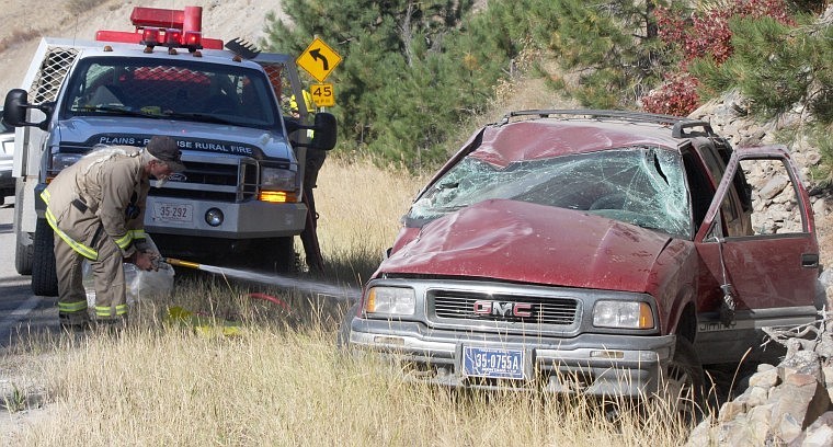 &lt;p&gt;Plains-Paradise Rural Fire District Lt. Pat Irving, tends to the rollover, hosing the vehicle off.&#160;&lt;/p&gt;