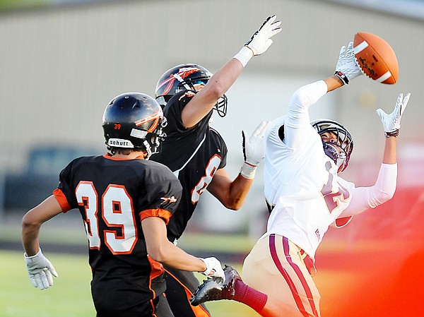 &lt;p&gt;Flathead senior defensive backs Brandon Gilpin and Connor Eaton
(39) put pressure on Big Sky junior wide receiver Nico Graham
during first-half play.The pass fell incomplete.&lt;/p&gt;