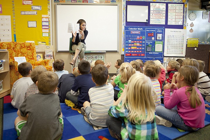 &lt;p&gt;Lindsey Bushnell reads &#147;Dinosaurs before Dark&#148; to her
kindergarten class of 25 students at Peterson Elementary School
Friday morning. Kindergarten enrollment in Kalispell Public Schools
this year is up 14 percent over last year.&lt;/p&gt;