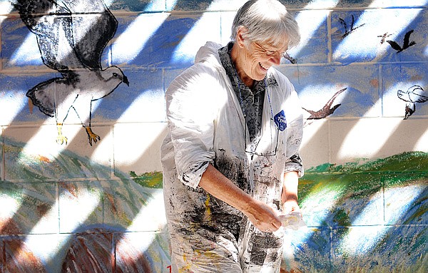 Karin Connelly, artist and volunteer for Literacy Volunteers, packs up her supplies at the Juvenile Detention Center on Thursday in Kalispell. Connelly has been working with various kids at the center on the mural for the last three years.