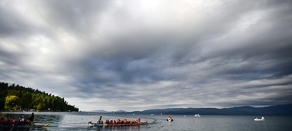 &lt;p&gt;The last of the rain clouds begin to clear from the sky at the start of the 2013 Montana Dragon Boat Festival on Saturday morning at the Flathead Lake Lodge in Bigfork. This year the festival expanded from the 56 boats that raced the first year to 91, and a second day of racing was added as well.&lt;/p&gt;