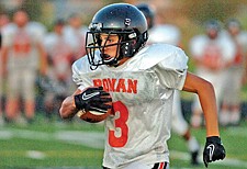 Freshman Conner Benn streaks forward on a run play during the Ronan Orange/Black Scrimmage last Friday in Ronan.