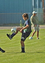 Junior Giorgio Traini gets a leg up on the ball during Polson's soccer scrimmage two weeks ago.